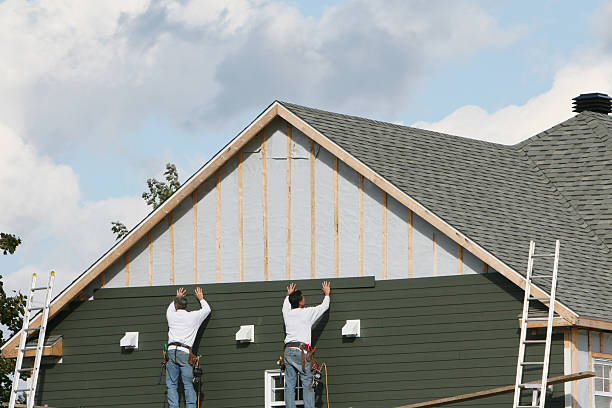 Professional Storm Damage Siding Repair technician working in Dublin, OH